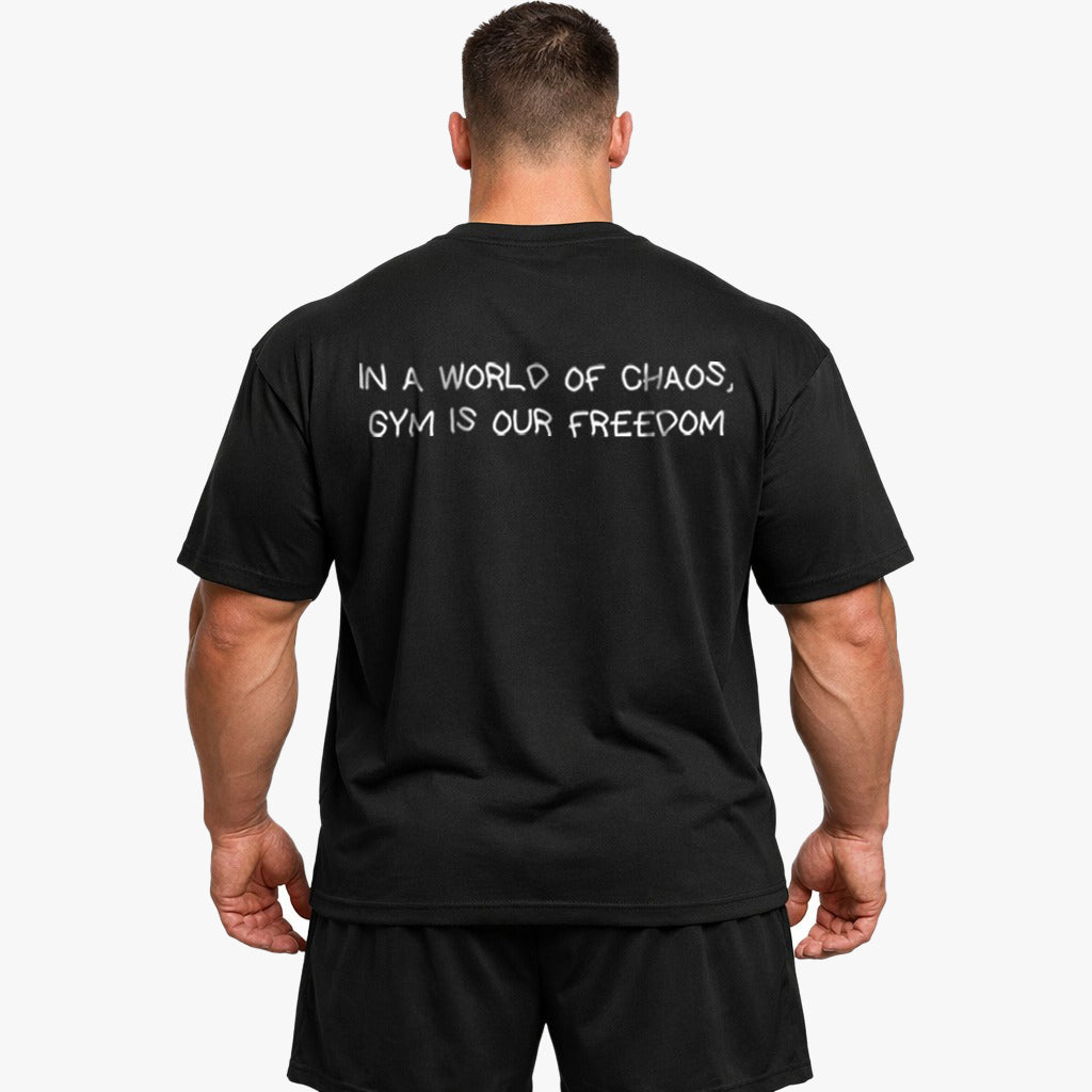 IN A WORLD OF CHAOS, GYM IS OUR FREEDOM Oversized (Backprint) Shirt