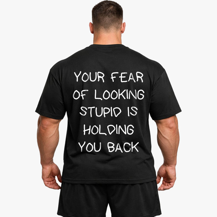 YOUR FEAR OF LOOKING STUPID IS HOLDING YOU BACK Oversized (Backprint) Shirt